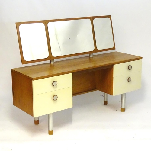 1228 - Vintage Retro, Mid Century: a 1970s teak and formica dressing table with triptych mirror and four dr... 