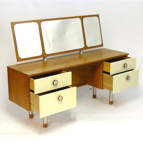 1228 - Vintage Retro, Mid Century: a 1970s teak and formica dressing table with triptych mirror and four dr... 