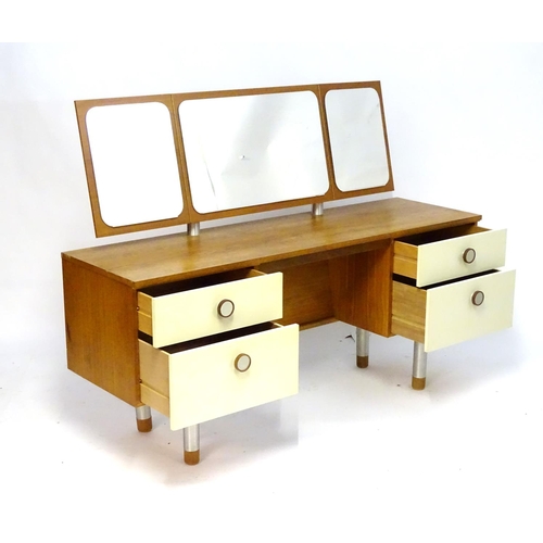 1228 - Vintage Retro, Mid Century: a 1970s teak and formica dressing table with triptych mirror and four dr... 