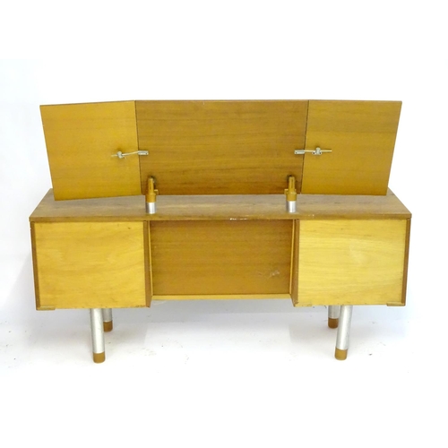 1228 - Vintage Retro, Mid Century: a 1970s teak and formica dressing table with triptych mirror and four dr... 