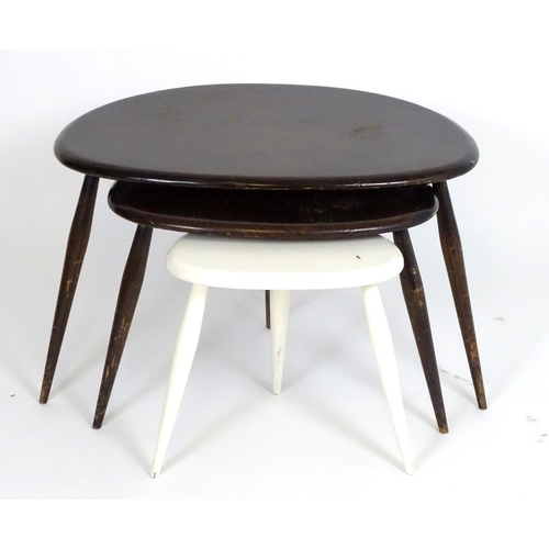 1229 - Vintage Retro, Mid Century: an Ercol nest of 'Mushroom' tables, of elm and beech construction, one w... 