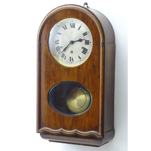 1184 - An early to mid 20thC wall clock, the arch top mahogany case with glazed sections, the 7