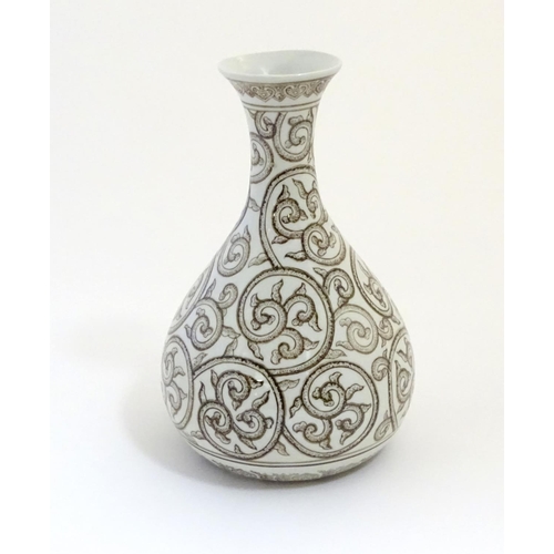 2 - A Chinese baluster vase with a flared rim decorated with stylised scrolling foliage with dotwork det... 