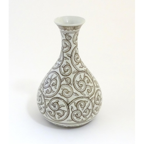 2 - A Chinese baluster vase with a flared rim decorated with stylised scrolling foliage with dotwork det... 