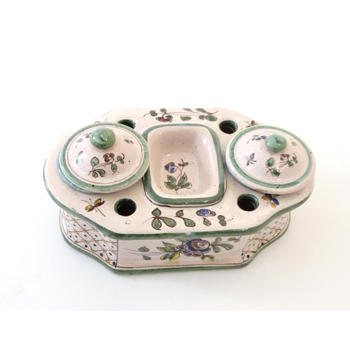 49 - A Continental faience standish with two lidded inkwells and floral and foliate detail. Approx. 3 1/4... 