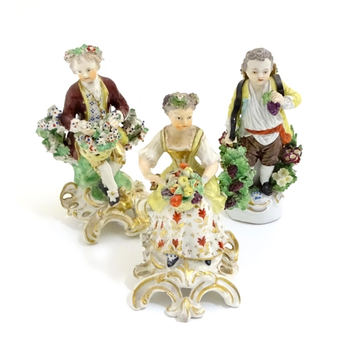 75 - Three Continental figures with flowers and fruit, possibly depicting seasons. One marked with crown ... 