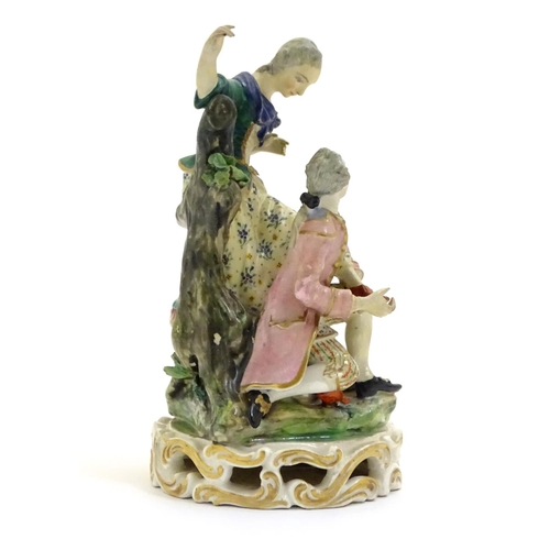 78 - A Continental porcelain figural group with two figures, a kneeling gentleman fitting a slipper on a ... 