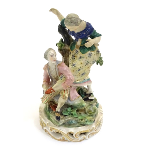 78 - A Continental porcelain figural group with two figures, a kneeling gentleman fitting a slipper on a ... 