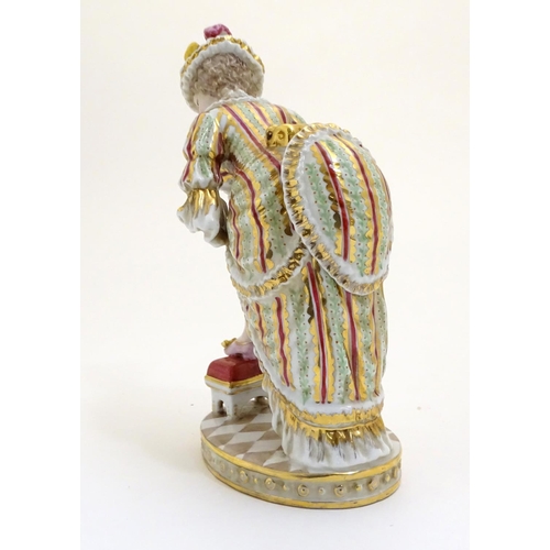 84 - A Russian Gardner figure modelled as a risque lady wearing a hat with plumes and ruffled dress her f... 