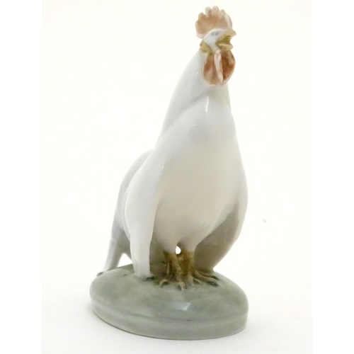 86 - A Royal Copenhagen porcelain model of standing Cockerel. Marked under. Approx. 4 1/4