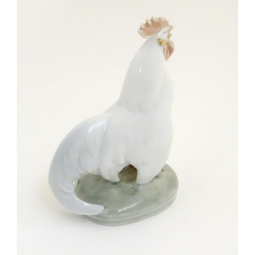 86 - A Royal Copenhagen porcelain model of standing Cockerel. Marked under. Approx. 4 1/4