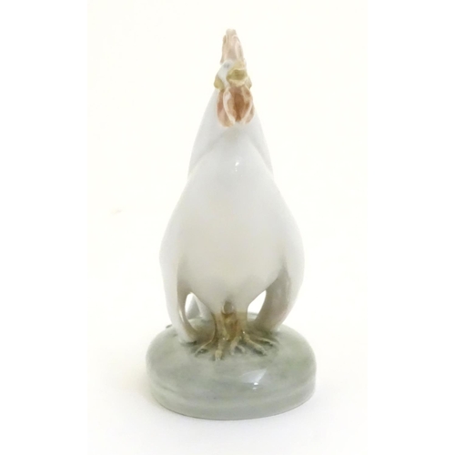 86 - A Royal Copenhagen porcelain model of standing Cockerel. Marked under. Approx. 4 1/4