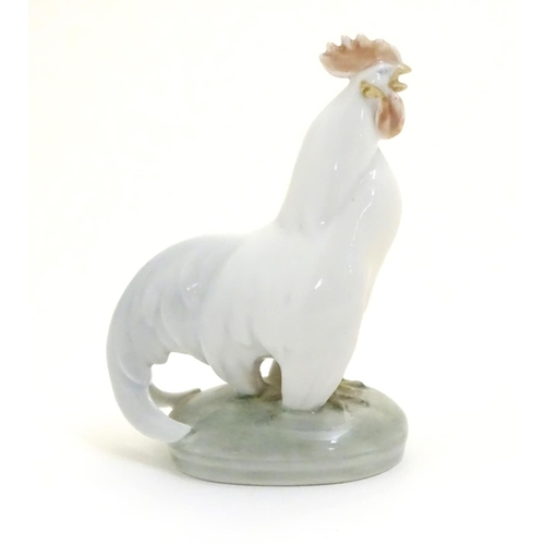 86 - A Royal Copenhagen porcelain model of standing Cockerel. Marked under. Approx. 4 1/4