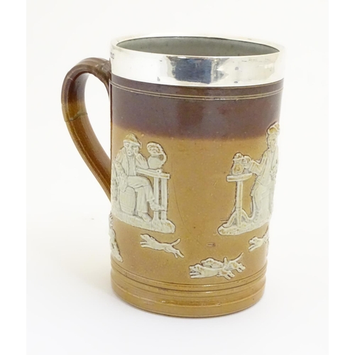 93 - A Royal Doulton salt glaze two tone tankard with a silver rim hallmarked Sheffield 1909, maker Lee &... 