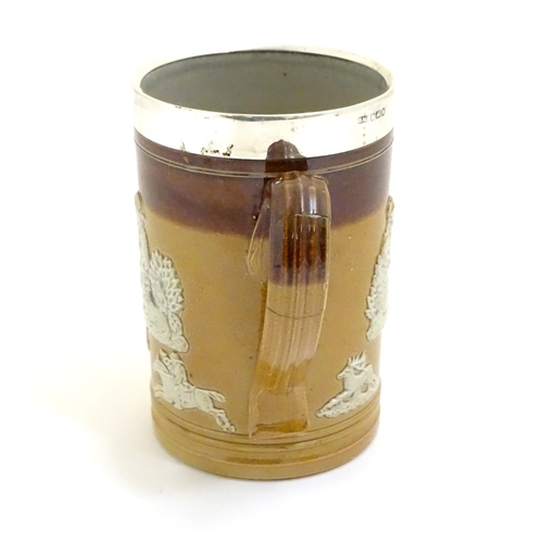 93 - A Royal Doulton salt glaze two tone tankard with a silver rim hallmarked Sheffield 1909, maker Lee &... 