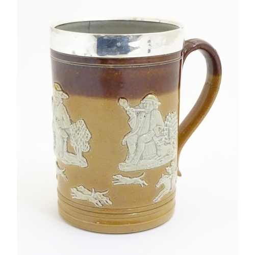 93 - A Royal Doulton salt glaze two tone tankard with a silver rim hallmarked Sheffield 1909, maker Lee &... 