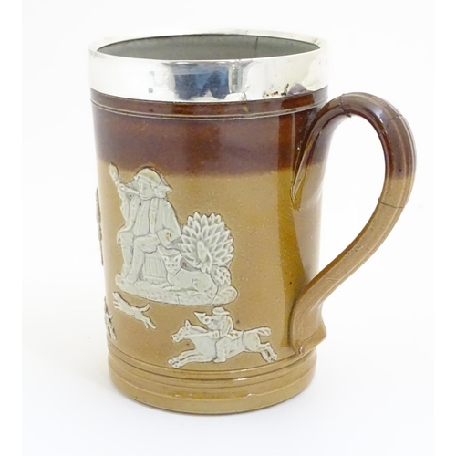 93 - A Royal Doulton salt glaze two tone tankard with a silver rim hallmarked Sheffield 1909, maker Lee &... 