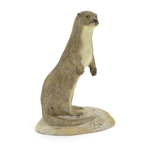 100 - An Acorn pottery model of a standing otter. Signed P. Tunstall under. Approx. 3 3/4