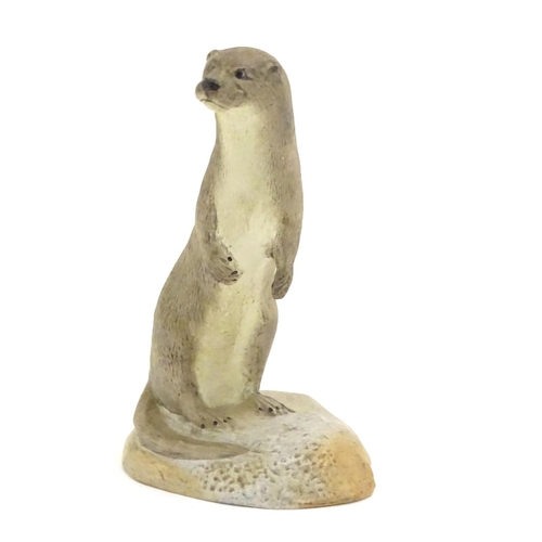 100 - An Acorn pottery model of a standing otter. Signed P. Tunstall under. Approx. 3 3/4