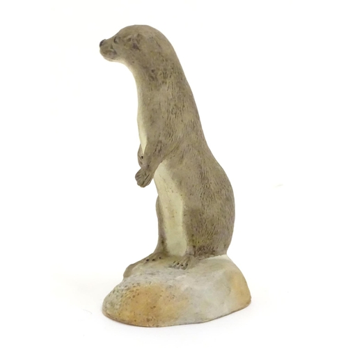 100 - An Acorn pottery model of a standing otter. Signed P. Tunstall under. Approx. 3 3/4