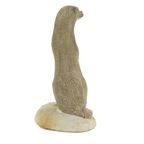 100 - An Acorn pottery model of a standing otter. Signed P. Tunstall under. Approx. 3 3/4