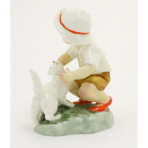 103 - A Royal Worcester figure, Snowy, modelled as a child with a white cat . Marked under with title, mod... 