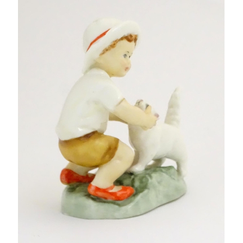 103 - A Royal Worcester figure, Snowy, modelled as a child with a white cat . Marked under with title, mod... 