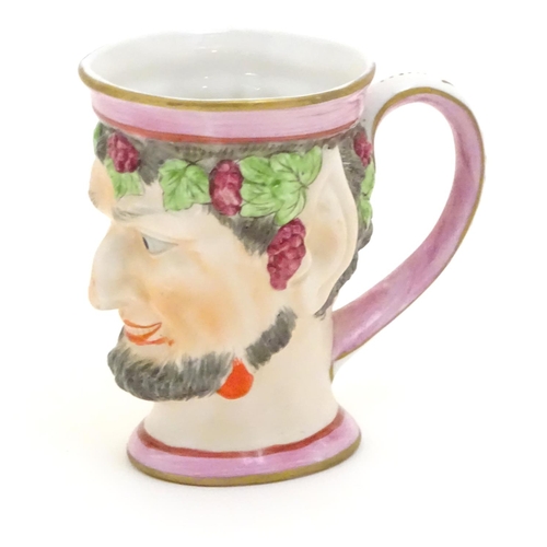 105 - A Victorian Staffordshire character mug modeled as Bacchus. Approx. 4