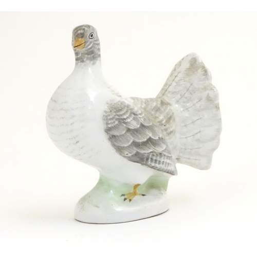 106 - A porcelain model of a fantail pigeon. Approx. 4