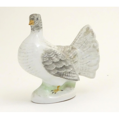 106 - A porcelain model of a fantail pigeon. Approx. 4