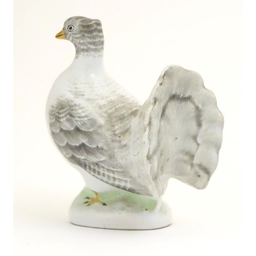 106 - A porcelain model of a fantail pigeon. Approx. 4