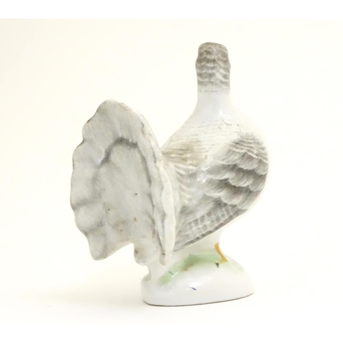 106 - A porcelain model of a fantail pigeon. Approx. 4