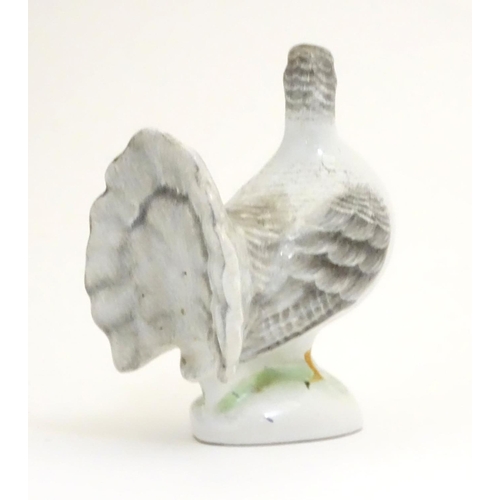 106 - A porcelain model of a fantail pigeon. Approx. 4