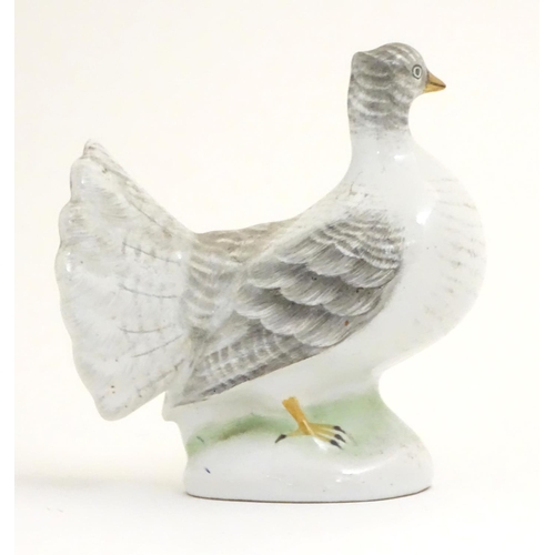 106 - A porcelain model of a fantail pigeon. Approx. 4