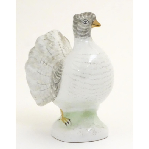 106 - A porcelain model of a fantail pigeon. Approx. 4