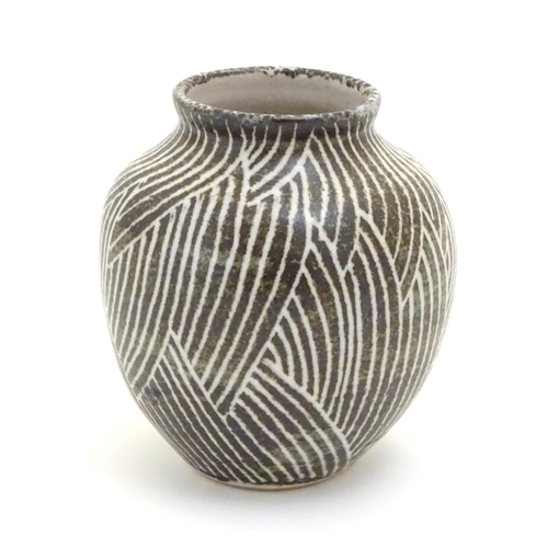 110 - A studio pottery vase of squat baluster form, with monochrome decoration. Incised maker's mark under... 