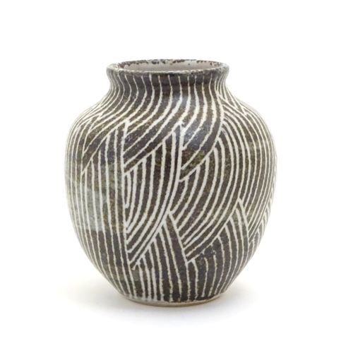 110 - A studio pottery vase of squat baluster form, with monochrome decoration. Incised maker's mark under... 