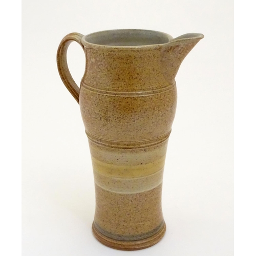 117 - Two items of studio pottery to include a John Chipperfield stoneware jug, marked under, and a stonew... 