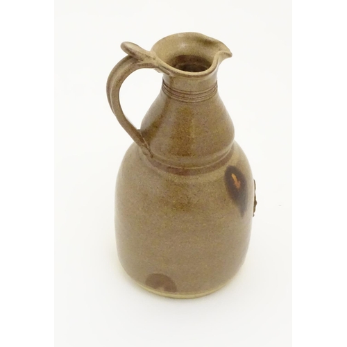 117 - Two items of studio pottery to include a John Chipperfield stoneware jug, marked under, and a stonew... 