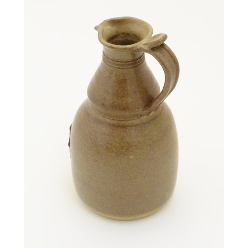 117 - Two items of studio pottery to include a John Chipperfield stoneware jug, marked under, and a stonew... 