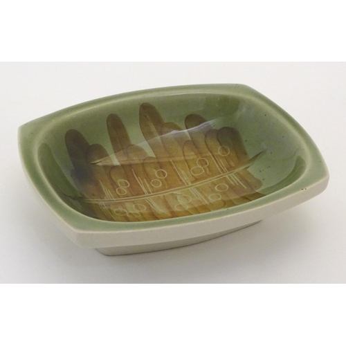 119 - A Ditmar Urbach slipware bowl with hand painted green and brown abstract detail. Marked under and im... 