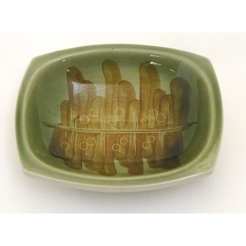 119 - A Ditmar Urbach slipware bowl with hand painted green and brown abstract detail. Marked under and im... 