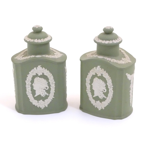 124 - A pair of Wedgwood sage green Jasperware tea caddies and covers, decorated with portrait medallions ... 