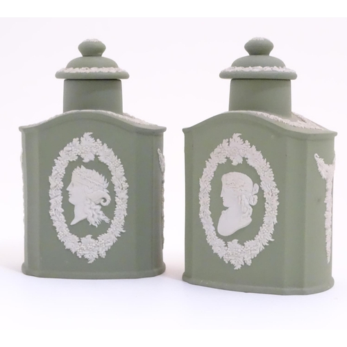 124 - A pair of Wedgwood sage green Jasperware tea caddies and covers, decorated with portrait medallions ... 