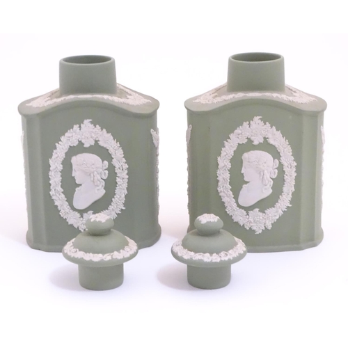 124 - A pair of Wedgwood sage green Jasperware tea caddies and covers, decorated with portrait medallions ... 