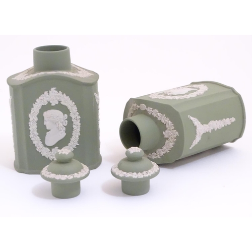 124 - A pair of Wedgwood sage green Jasperware tea caddies and covers, decorated with portrait medallions ... 