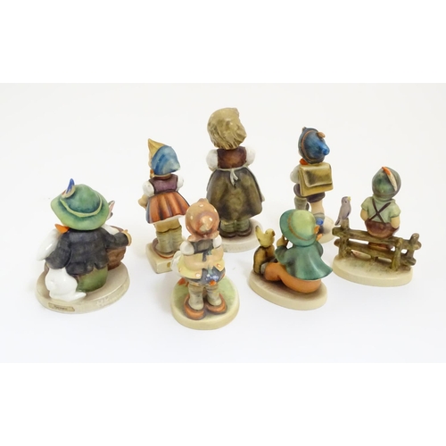 127 - A collection of seven vintage Hummel figurines, comprising #47 Goose Girl, #58/0 Playmates, #63 Sing... 