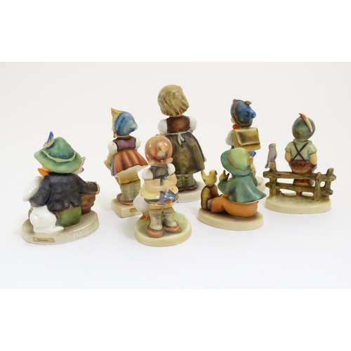 127 - A collection of seven vintage Hummel figurines, comprising #47 Goose Girl, #58/0 Playmates, #63 Sing... 