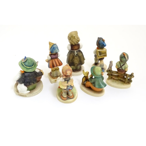 127 - A collection of seven vintage Hummel figurines, comprising #47 Goose Girl, #58/0 Playmates, #63 Sing... 