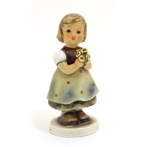 127 - A collection of seven vintage Hummel figurines, comprising #47 Goose Girl, #58/0 Playmates, #63 Sing... 